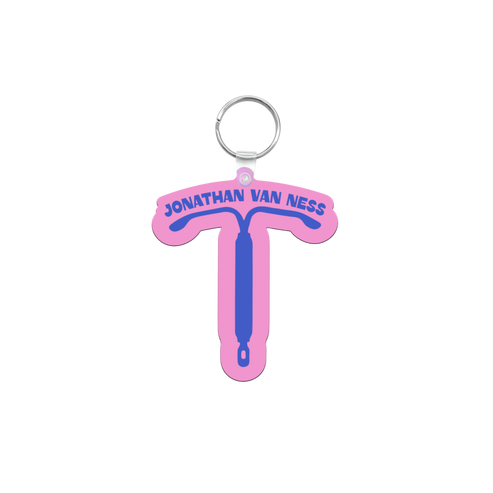 A pink and blue IUD shaped keychain featuring the text 'JONATHAN VAN NESS' in blue, with a silver metal key ring at the top