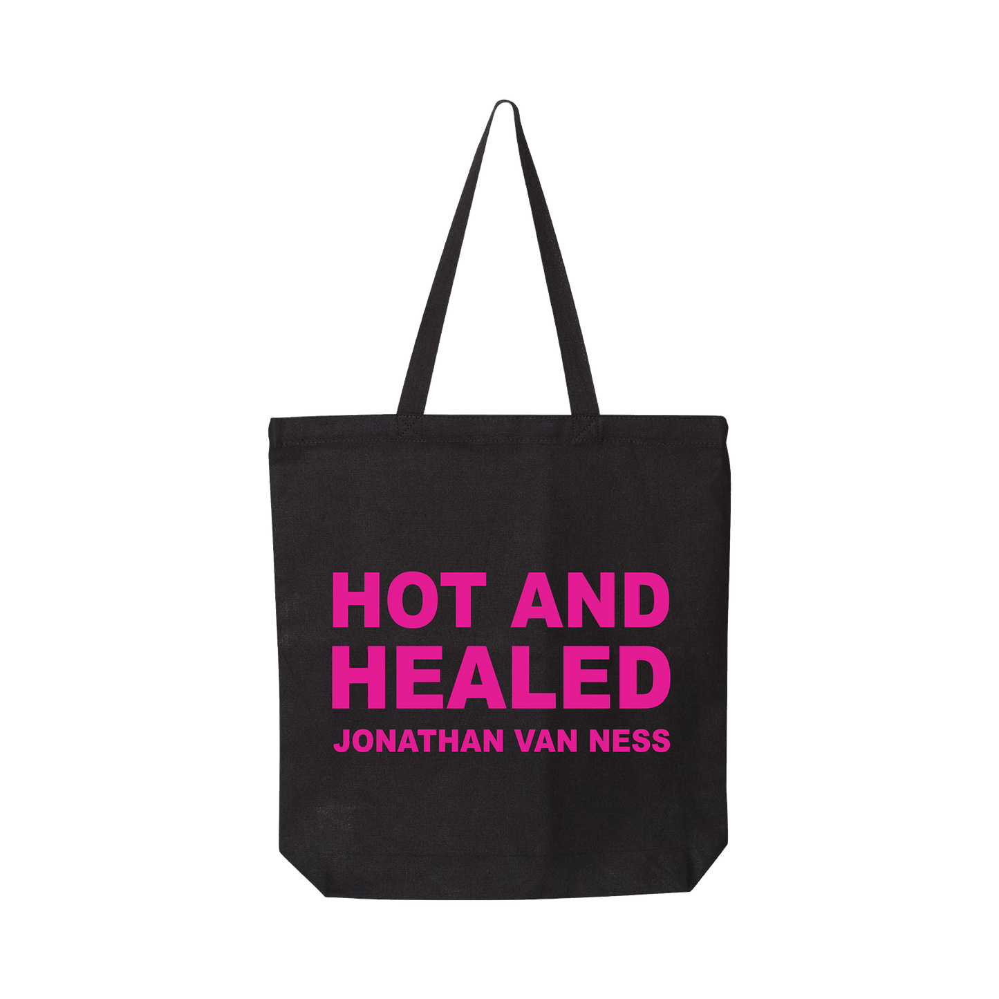 Jonathan Van Ness Hot and Healed black canvas tote bag with long black handles, featuring the text 'HOT AND HEALED' and 'JONATHAN VAN NESS' printed in bright pink on the front.